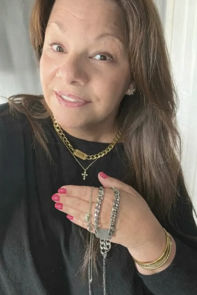 Lori from Blooming with Lori wearing permanent jewelry bracelets and necklaces