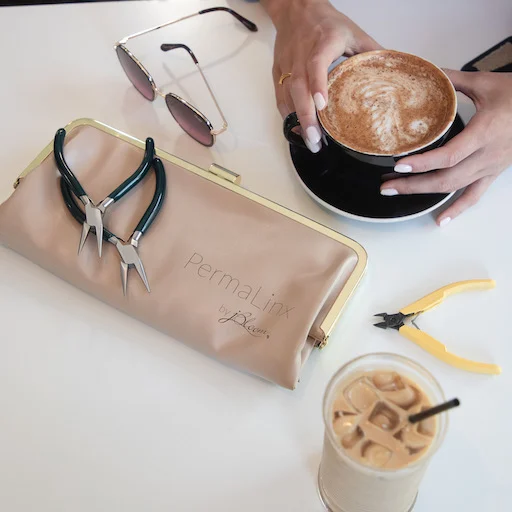 Permanent jewelry tools, custom jewelry accessories, and coffee flatlay from Blooming with Lori