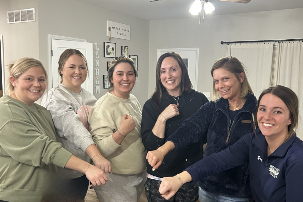 Women wearing weld-free permanent bracelets at a St. Louis jewelry party